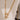Gold chain necklace with a star-shaped pendant on a white background