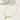 A gold-colored necklace with a rectangular pendant featuring an eye design, and green beads on a white background.