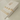 Gold jewelry set with floral designs on a white box