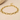 Gold chain link bracelet on neutral surface