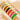 Set of colorful bracelets with gold accents on a light background