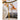 Gold and silver chain necklaces hanging on a branch with a blurred natural background