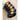 Black and gold bangles on a beige stone surface