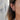 Close-up of an ear wearing gold hoop earrings with a blurred background