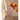 Necklace with colorful beads on a beige surface with orange fruits