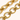Close-up of a gold chain on a white background