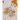 Gold and silver rings on a textured surface with blurred natural background