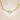 Gold chain necklace with a pearl pendant on a white shell background
