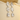 Silver earrings on a beige surface