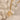 Gold necklace with a star-shaped pendant on a textured beige background