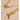Gold necklace with a unique clasp on a beige stone surface