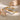 Gold and silver bangles on a stone surface