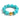 Turquoise beaded bracelet with a gold accent on a white background